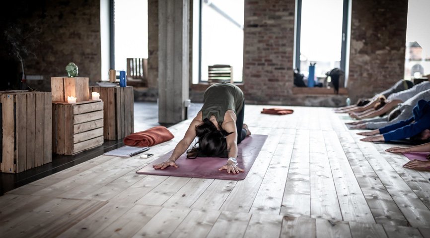 Yoga student practicing a mindful pose during a Breathe Circle class
